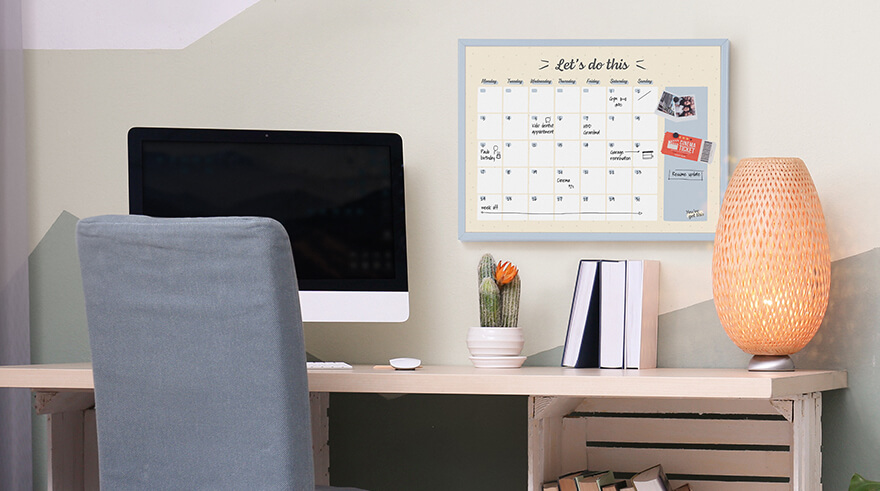 Bi-Office Pastel Magnetic Monthly Planner Board on a wall of a home office setting.