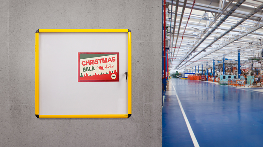 Ultrabrite Display Case on a factory wall with a Christmas Gala Announcement.
